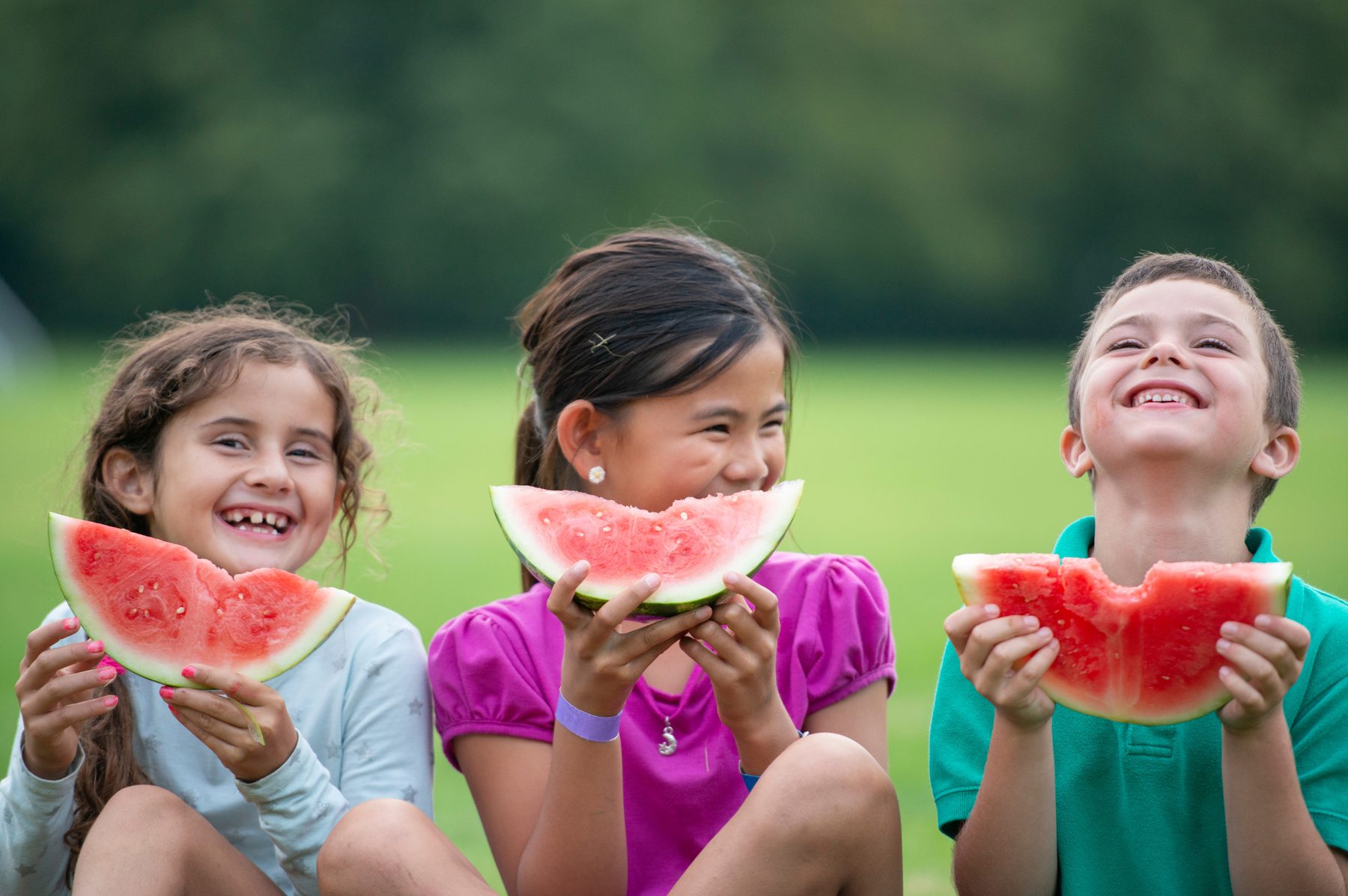 Children eating watermelon